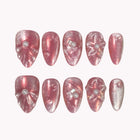 Elysian Rose Quartz rose-pink almond nails with a shimmering translucent finish, raised flowers and pearly accents.