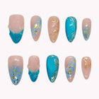 Aegean Gilded Vine nude and turquoise almond nails with blue marbling and fine gold-colored leaf accents.