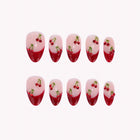 Ruby Cherry Crush: nude almond press-on nails with red French tips and cherry motifs, arranged on a pale background.