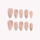 Calypso’s Gilded Tide: nude almond press-on nails with gold-toned tips and raised translucent wave textures, arranged on a pale background.