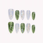 Ophelia’s River Gem: green and pearly white almond press-on nails with raised leaf-like textures, arranged on a pale background.