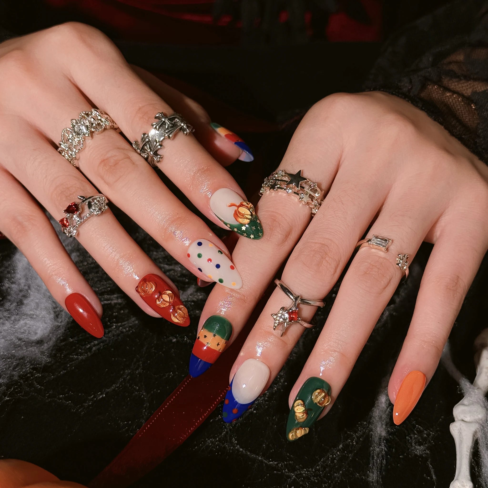 Pumpkin Parade Pop press-on nails worn on both hands in a styled lifestyle setting