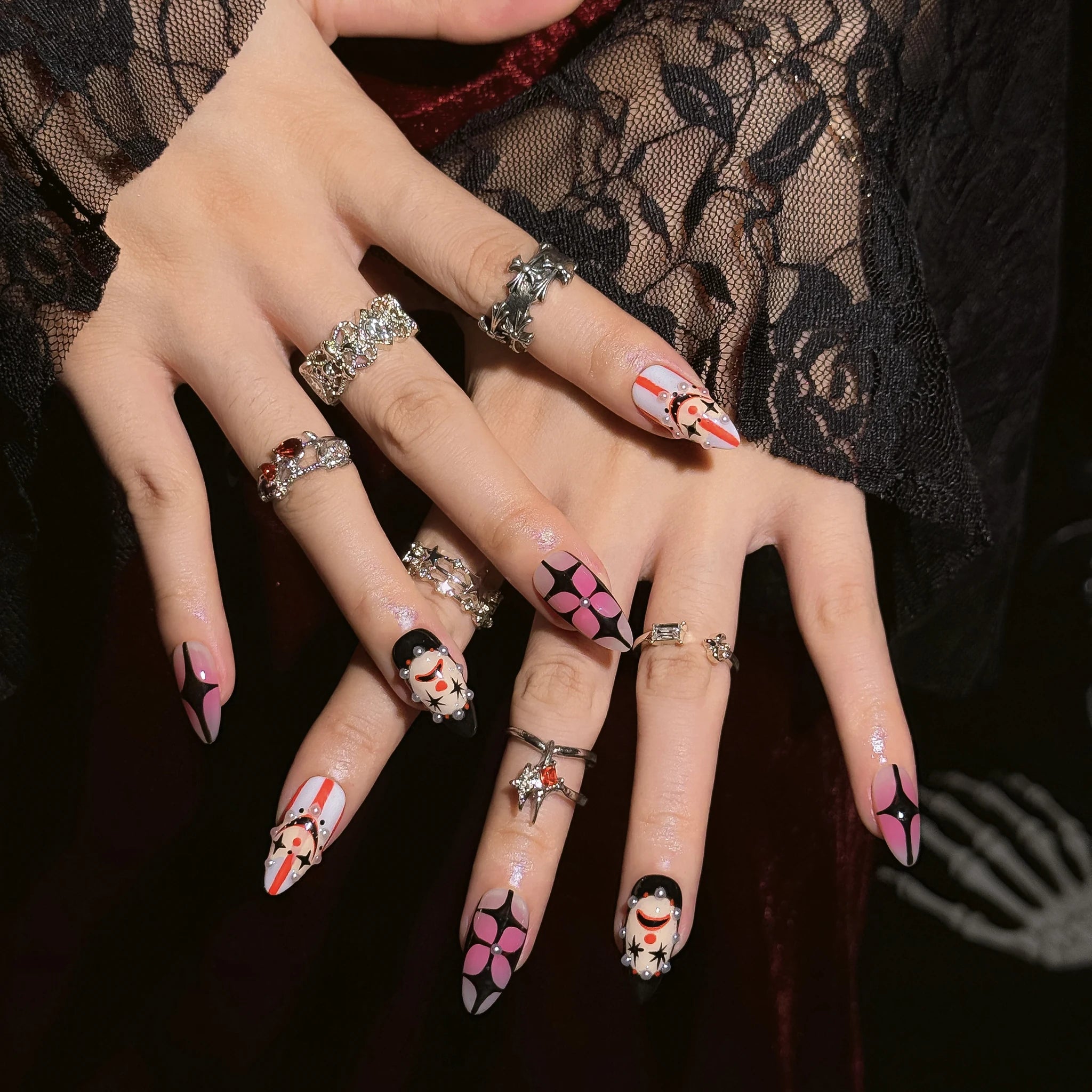 Velvet Jester Star press-on nails worn on both hands in a styled lifestyle setting