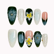 Jade Plumeria Reverie deep green, milky white and nude almond nails with sculpted flowers, yellow centers and pearly accents.