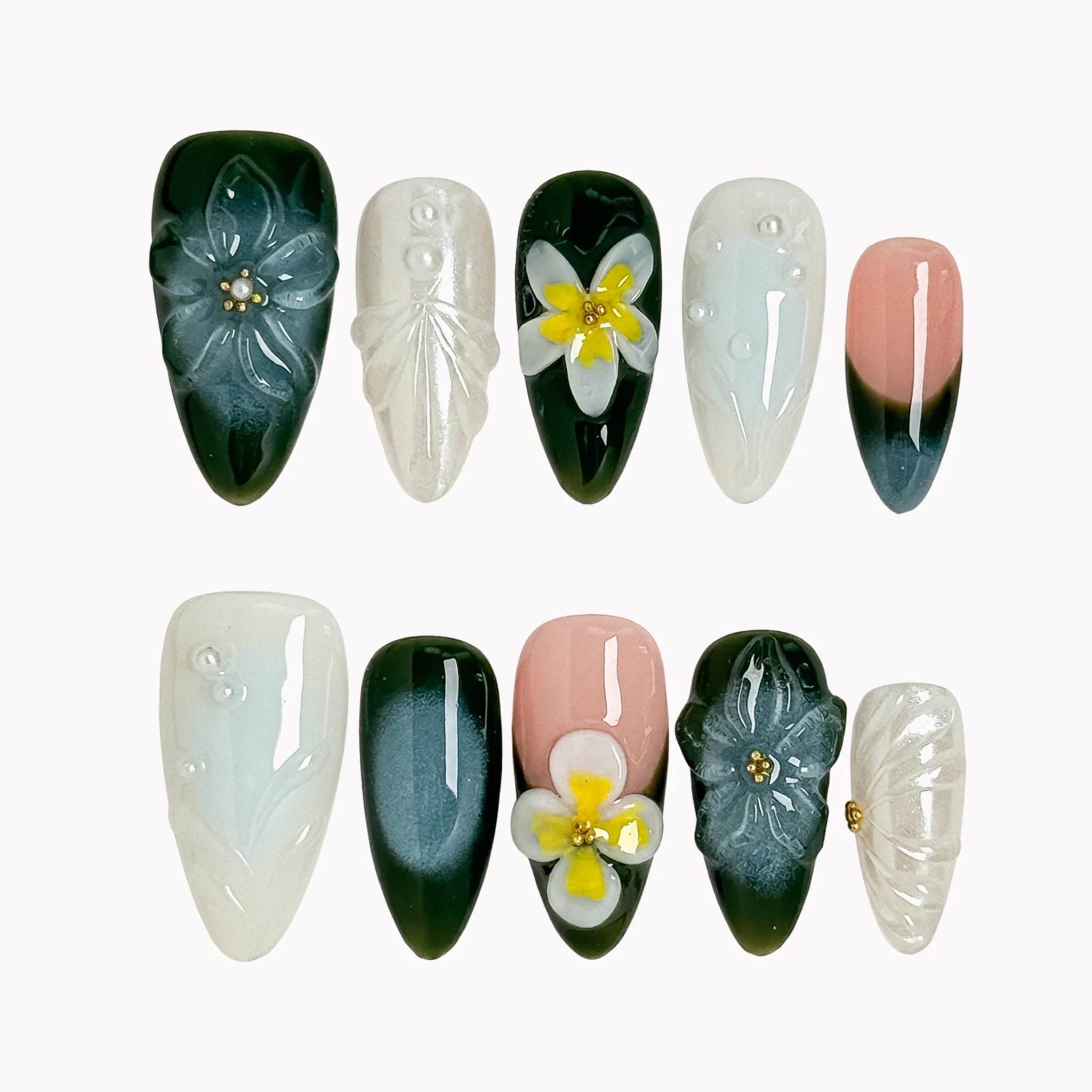 Jade Plumeria Reverie deep green, milky white and nude almond nails with sculpted flowers, yellow centers and pearly accents.