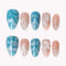 Azure Shell Tide press-on nails in blue, nude, and silver with shell texture, glitter, and pearl-like details