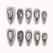 Moonlit Opal Relic press-on nails in ivory and silver with chrome frames, opal-like inlays, and raised 3D details