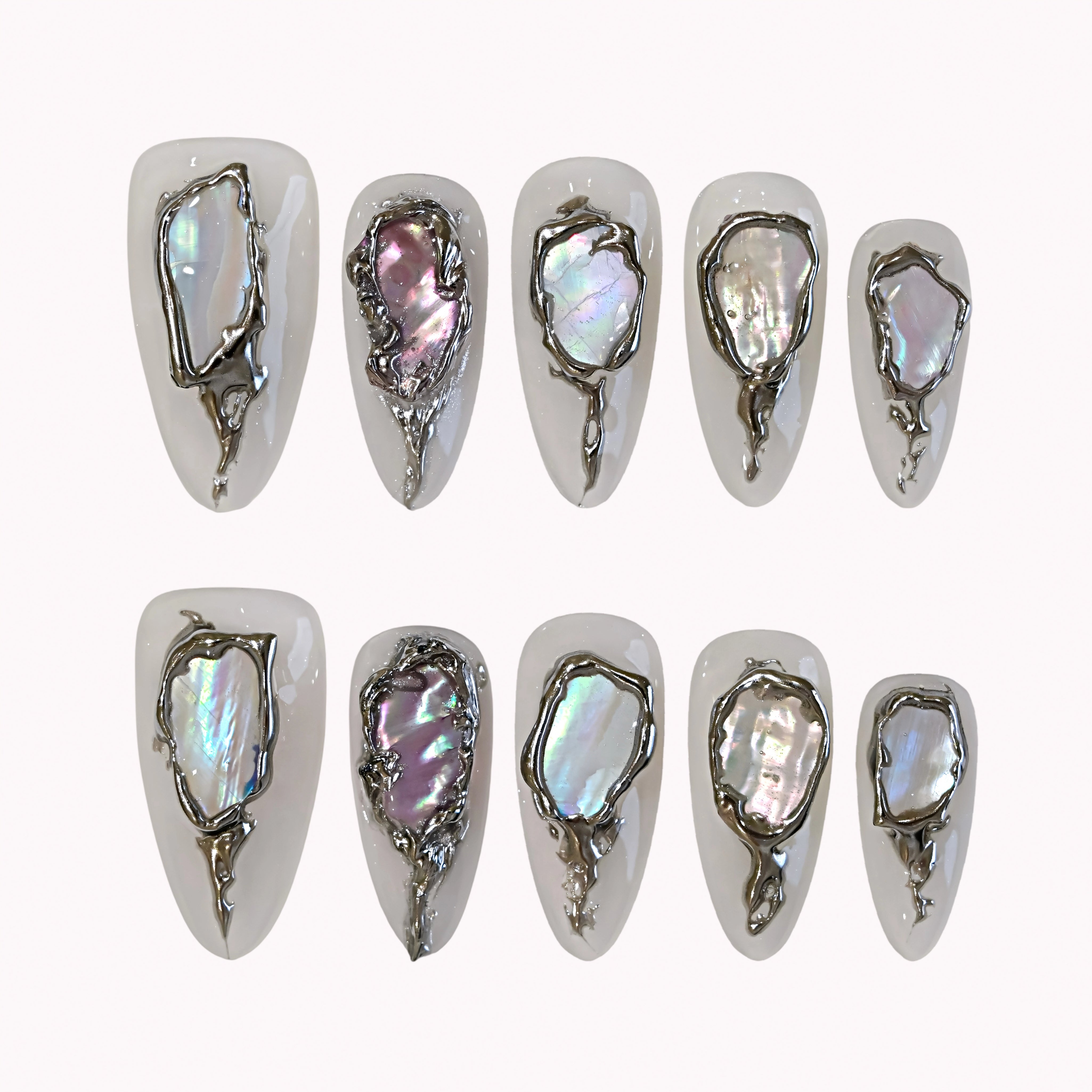 Moonlit Opal Relic press-on nails in ivory and silver with chrome frames, opal-like inlays, and raised 3D details