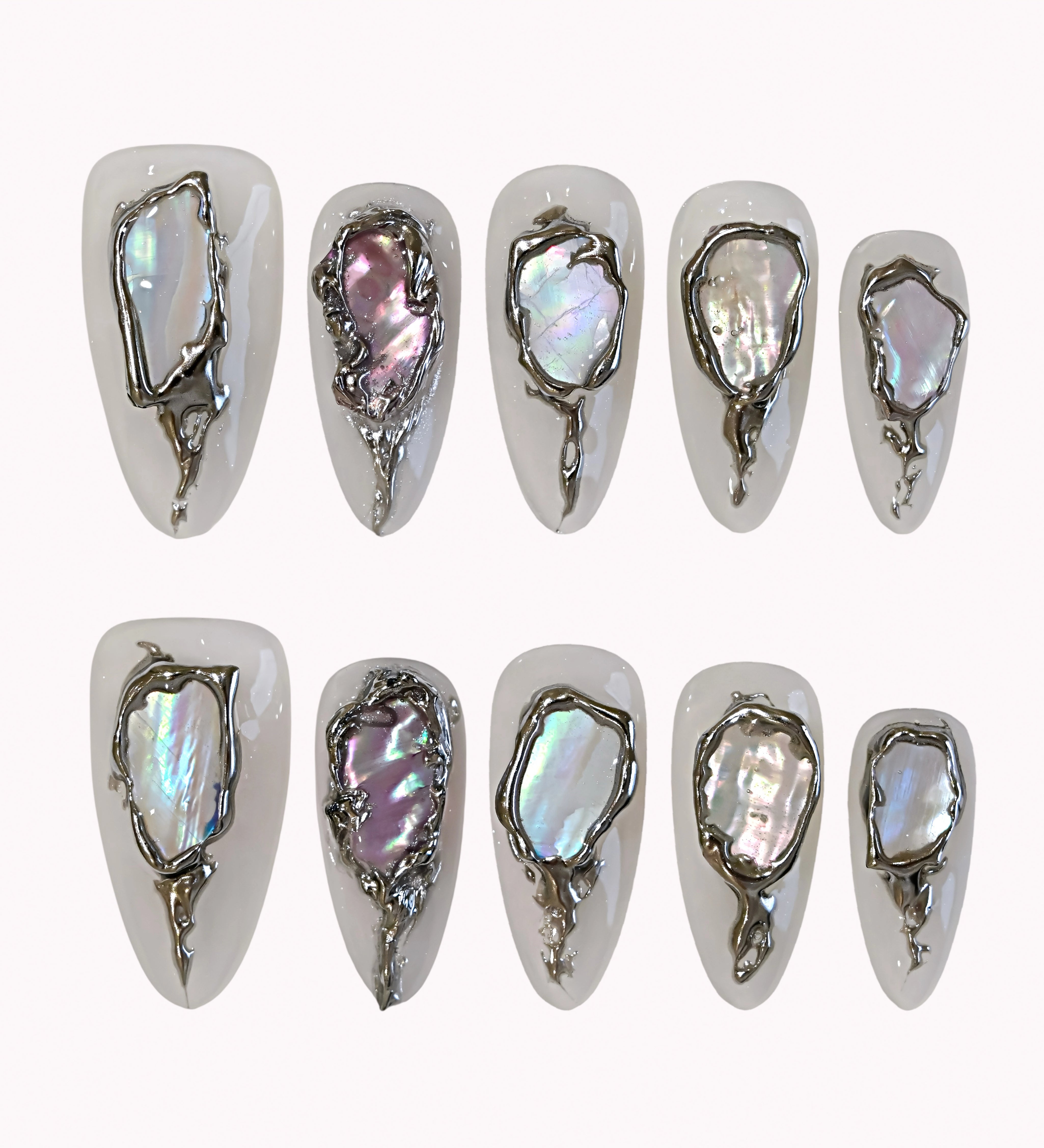 Moonlit Opal Relic press-on nails in ivory and silver with chrome frames, opal-like inlays, and raised 3D details