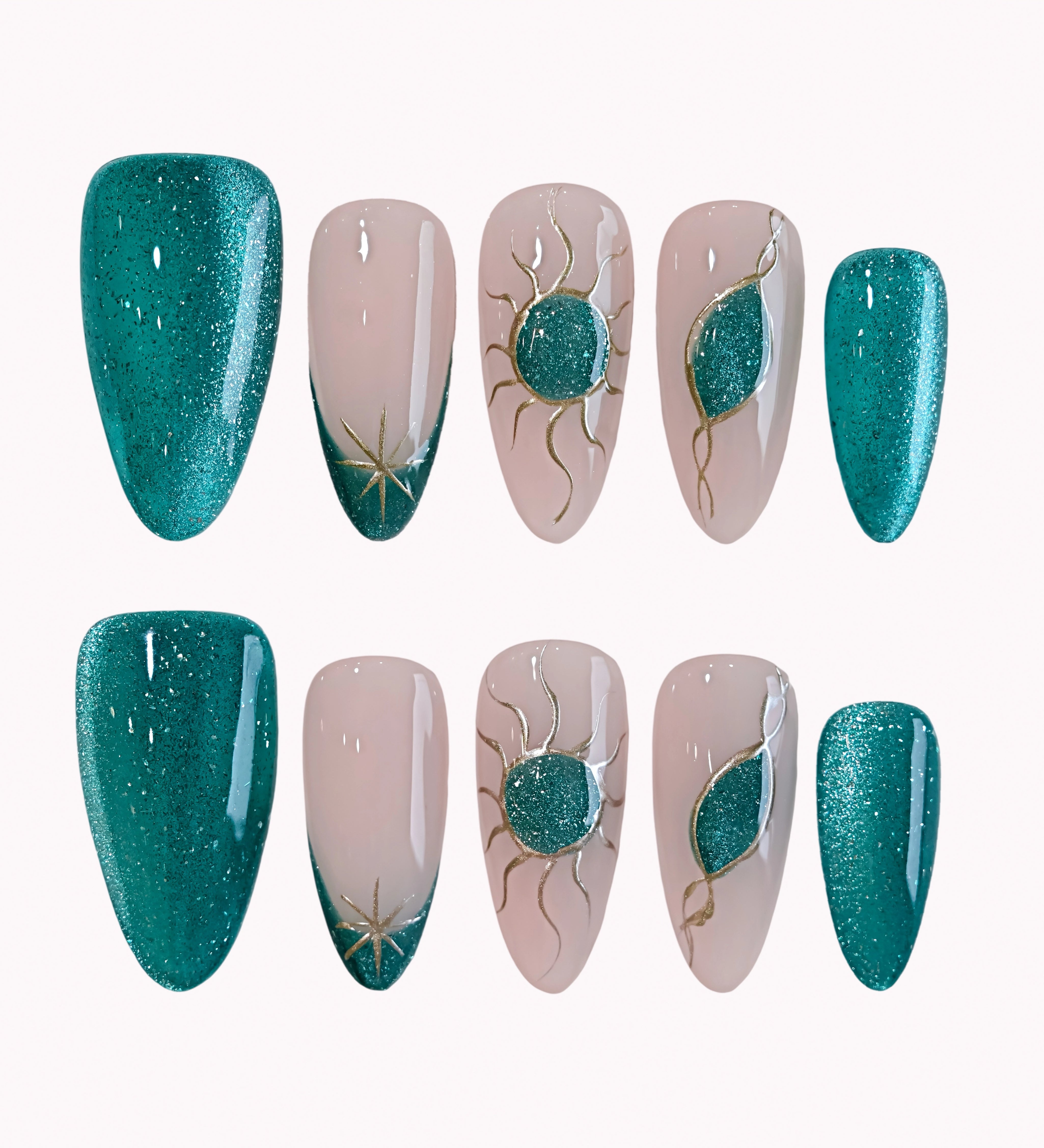 Emerald Solar Veil press-on nails in teal, nude, and gold with glitter, sun motifs, crescent accents, and star details