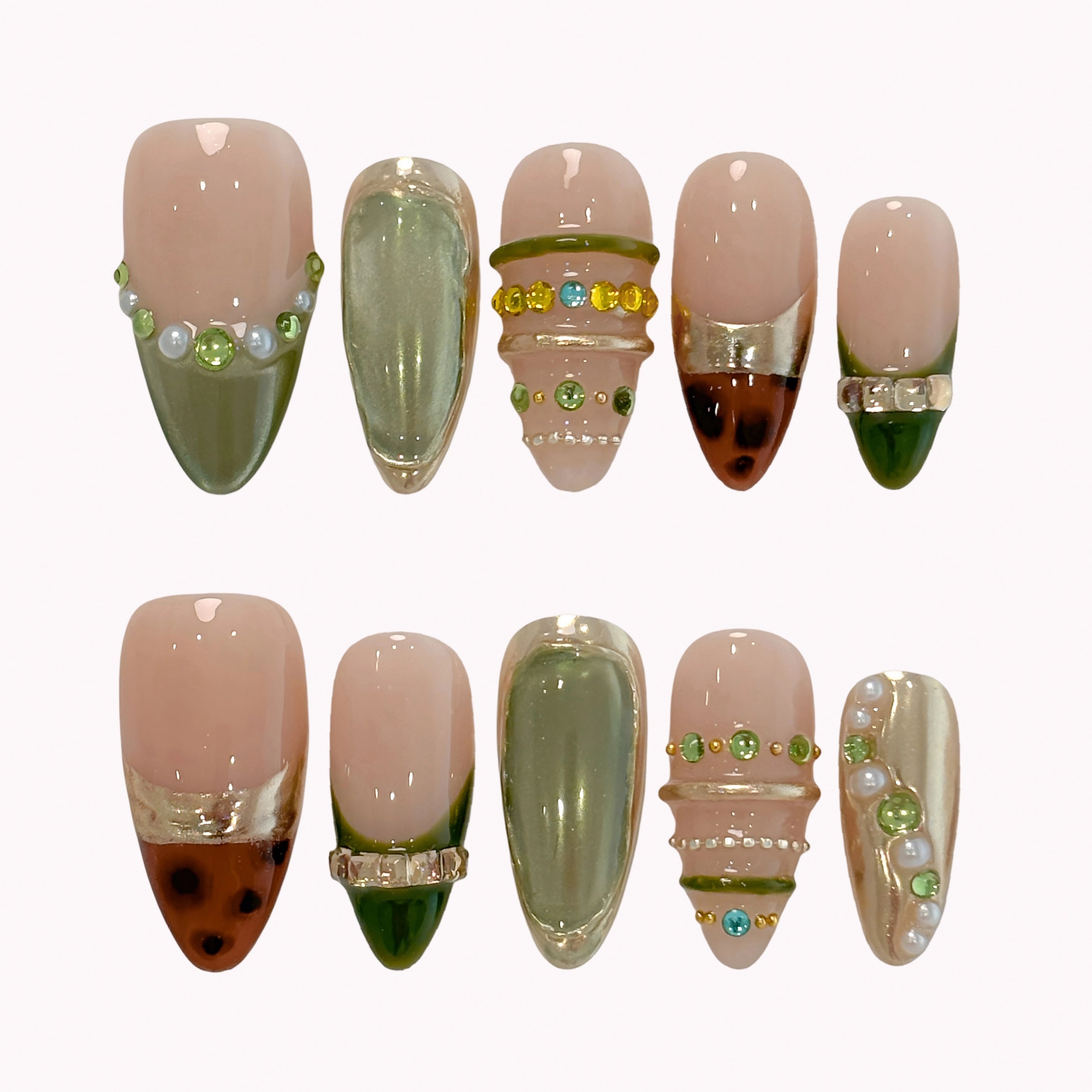 Olive Gilded Mirage press-on nails in nude, olive green, gold, and brown with pearls, crystals, and tortoise-inspired tips