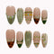 Olive Gilded Mirage press-on nails in nude, olive green, gold, and brown with pearls, crystals, and tortoise-inspired tips