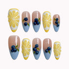 Lemonberry Daisy Reverie press-on nails in nude, blue, yellow, and white with daisies and 3D blueberry details