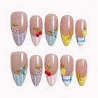 Pastel Orchard Reverie press-on nails in nude, blue, yellow, lavender, and white with 3D fruit details