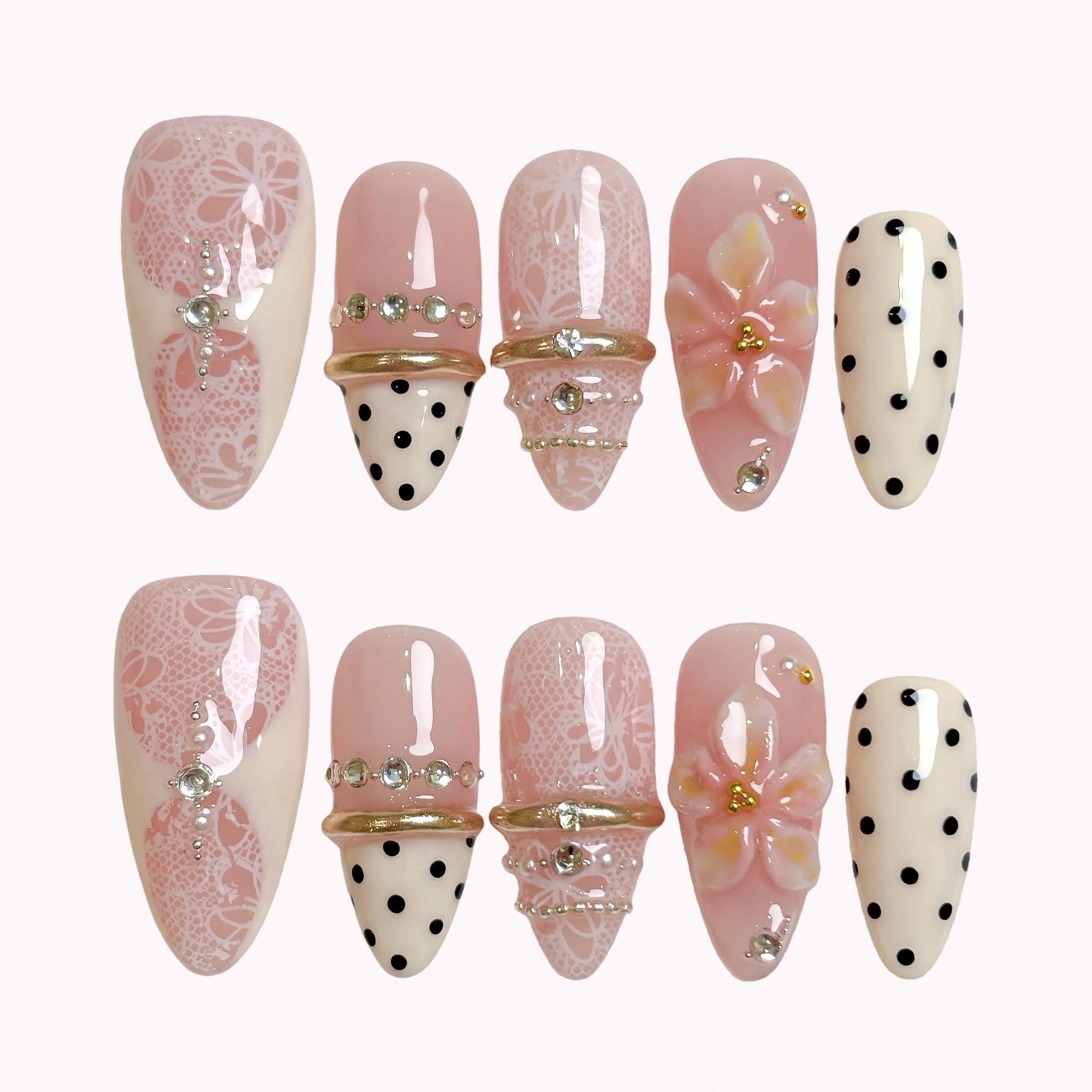 Blush Lace Amour press-on nails in nude pink, ivory, black, and gold with lace details, polka dots, crystals, and 3D flowers