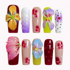 Carnival Bloom Reverie press-on nails in red, green, pink, yellow, purple, blue, nude, and white with 3D flowers, polka dots, and glossy details