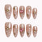Gilded Heart Aura press-on nails in nude, pink, white, and gold with starburst accents, crystals, marble details, and a glitter heart