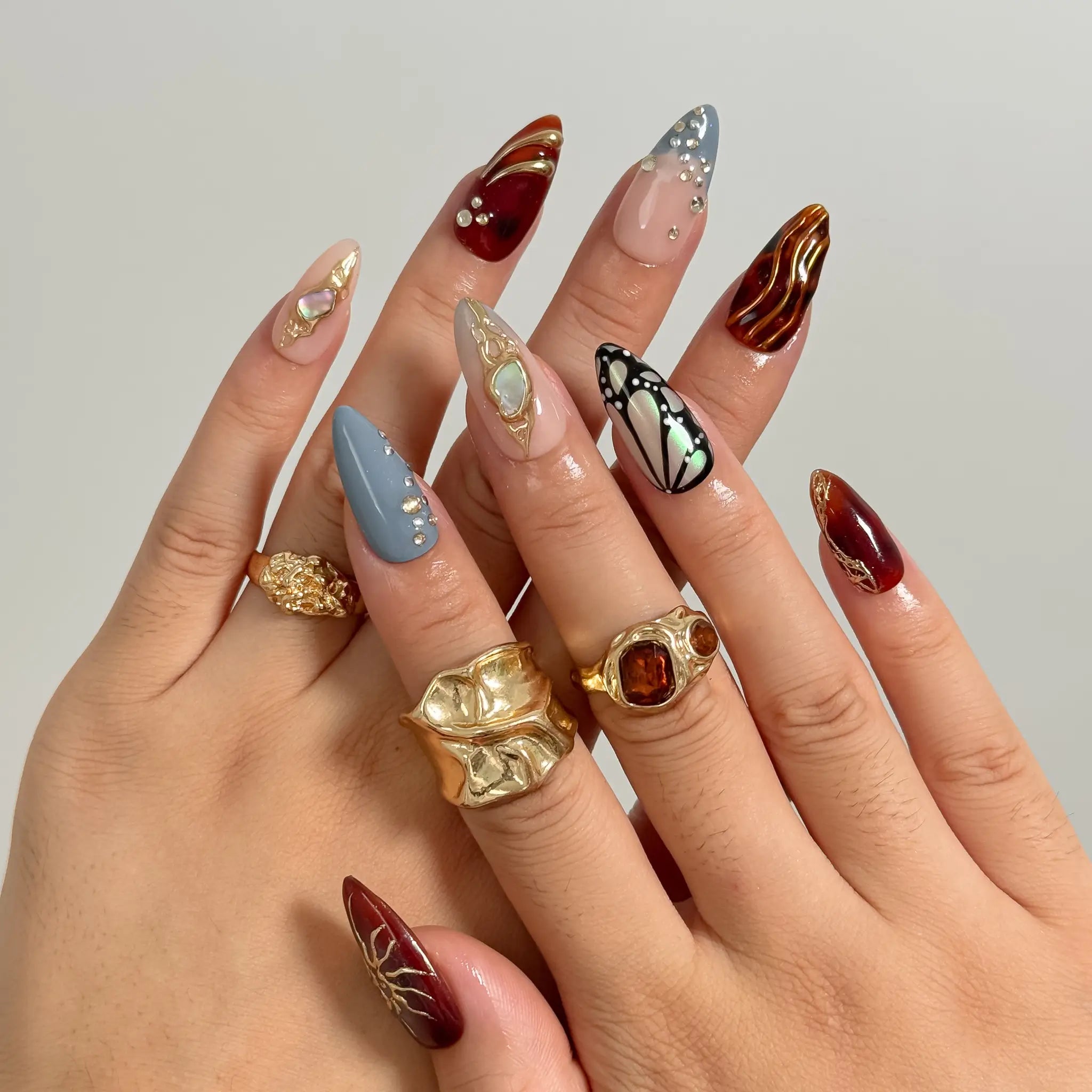 Opal Ember Orbit press-on nails in Nude, Red, Blue, Gold, detail view 4