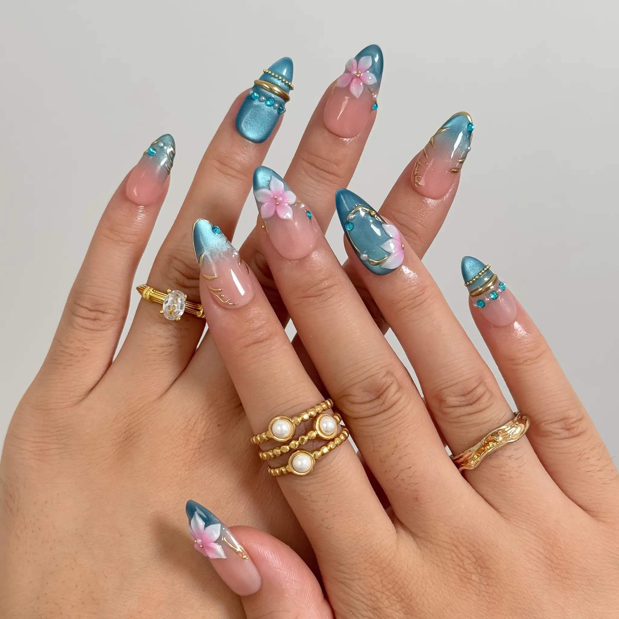 Lagoon Petal Treasure press-on nails in Blue, Pink, Gold, Nude, detail view 2