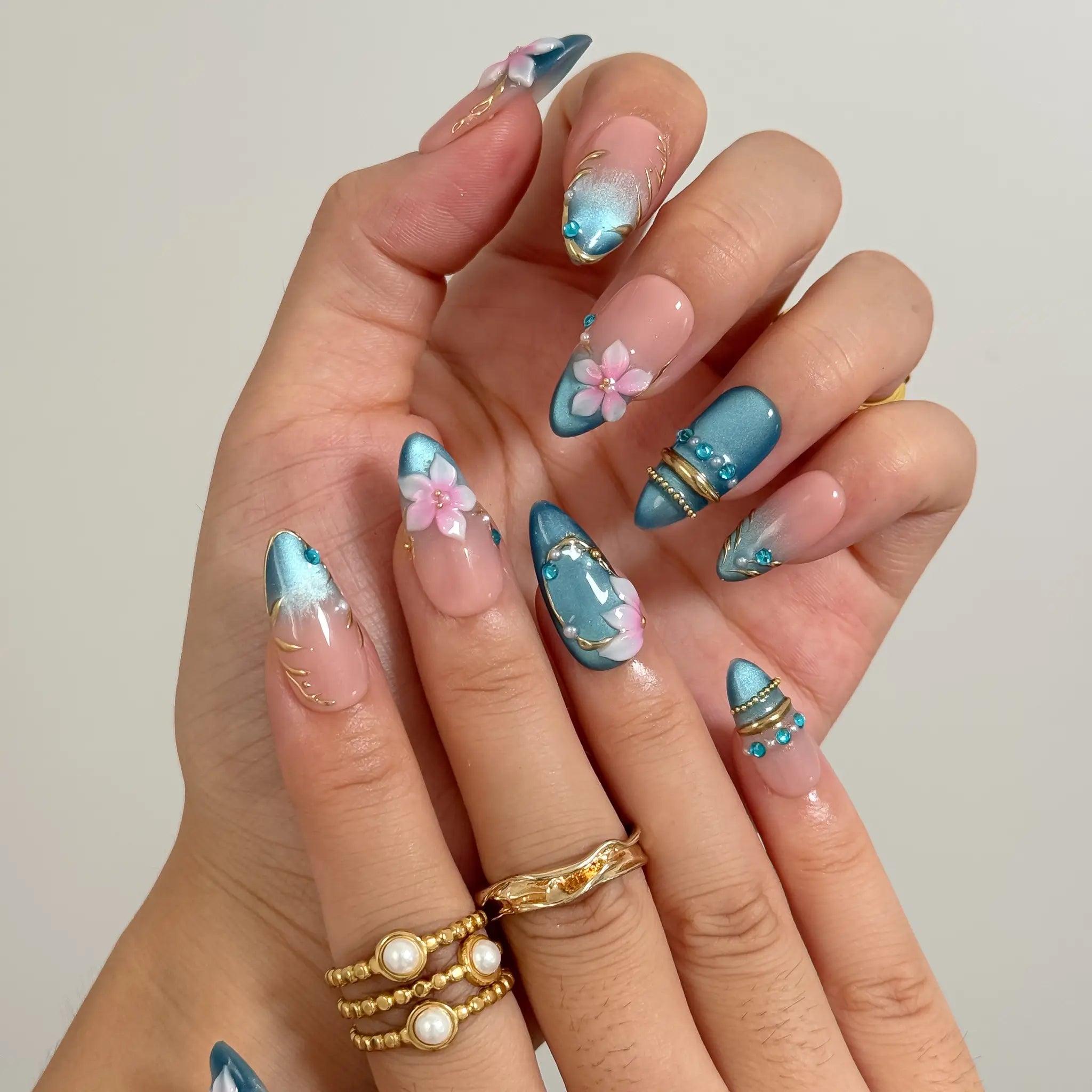 Lagoon Petal Treasure press-on nails in Blue, Pink, Gold, Nude, detail view 3