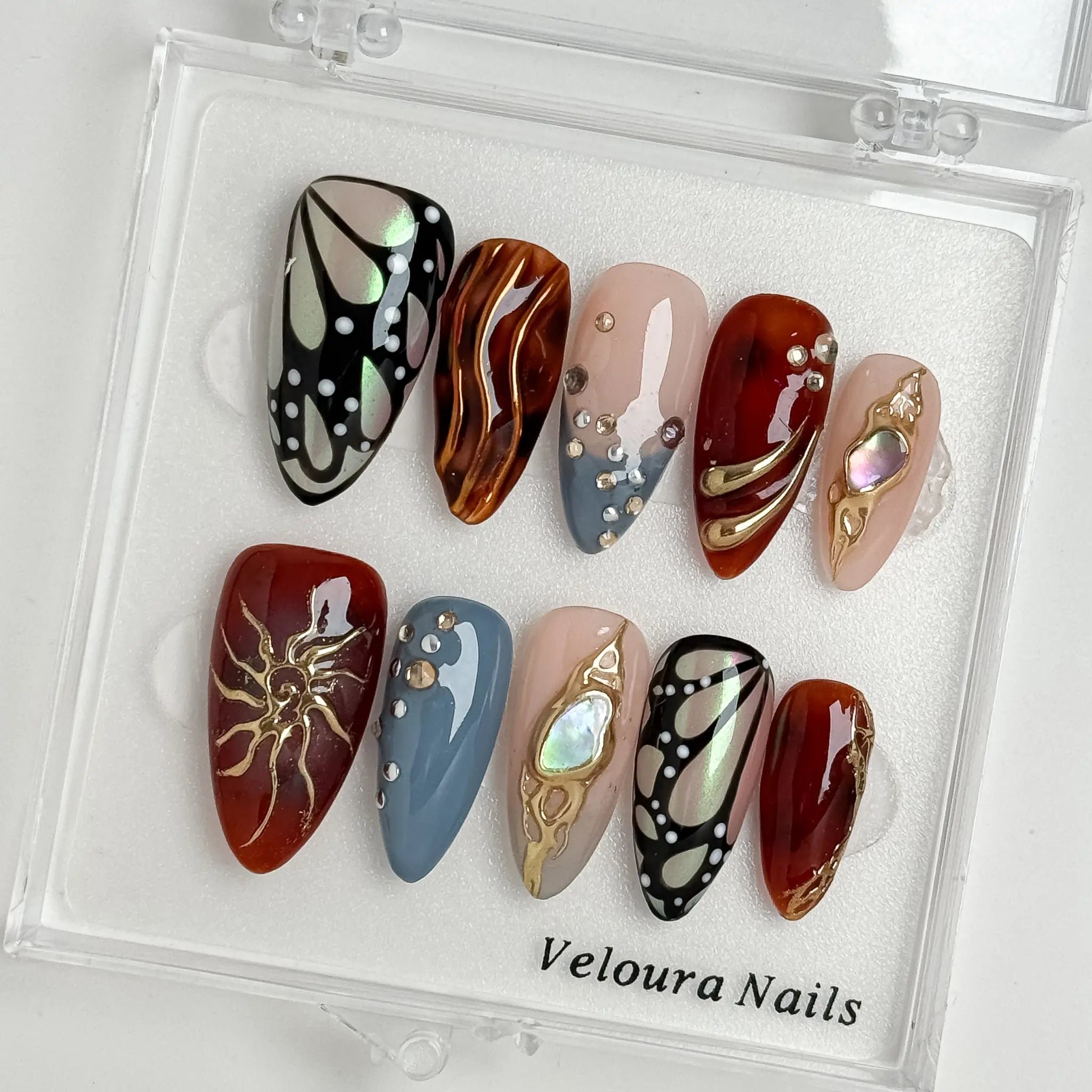 Opal Ember Orbit press-on nails in Nude, Red, Blue, Gold, detail view 1