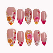 Sunset Petal Carnival press-on nails in Pink, Orange, Red, Gold on a white background