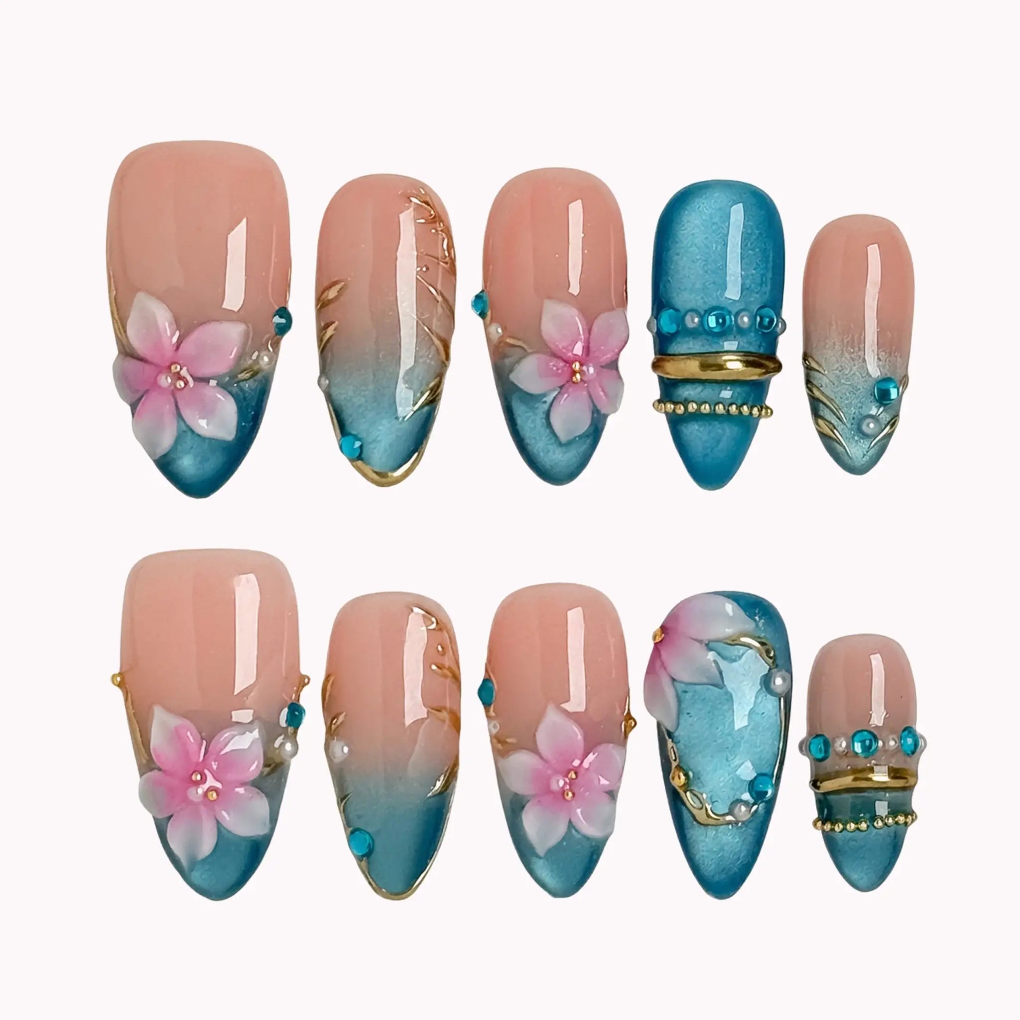 Lagoon Petal Treasure press-on nails in Blue, Pink, Gold, Nude on a white background