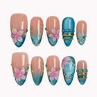 Lagoon Petal Treasure press-on nails in Blue, Pink, Gold, Nude on a white background