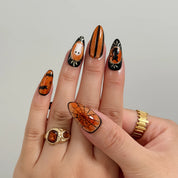 Midnight Pumpkin Portrait Long Almond press-on nails, modeled detail view 3