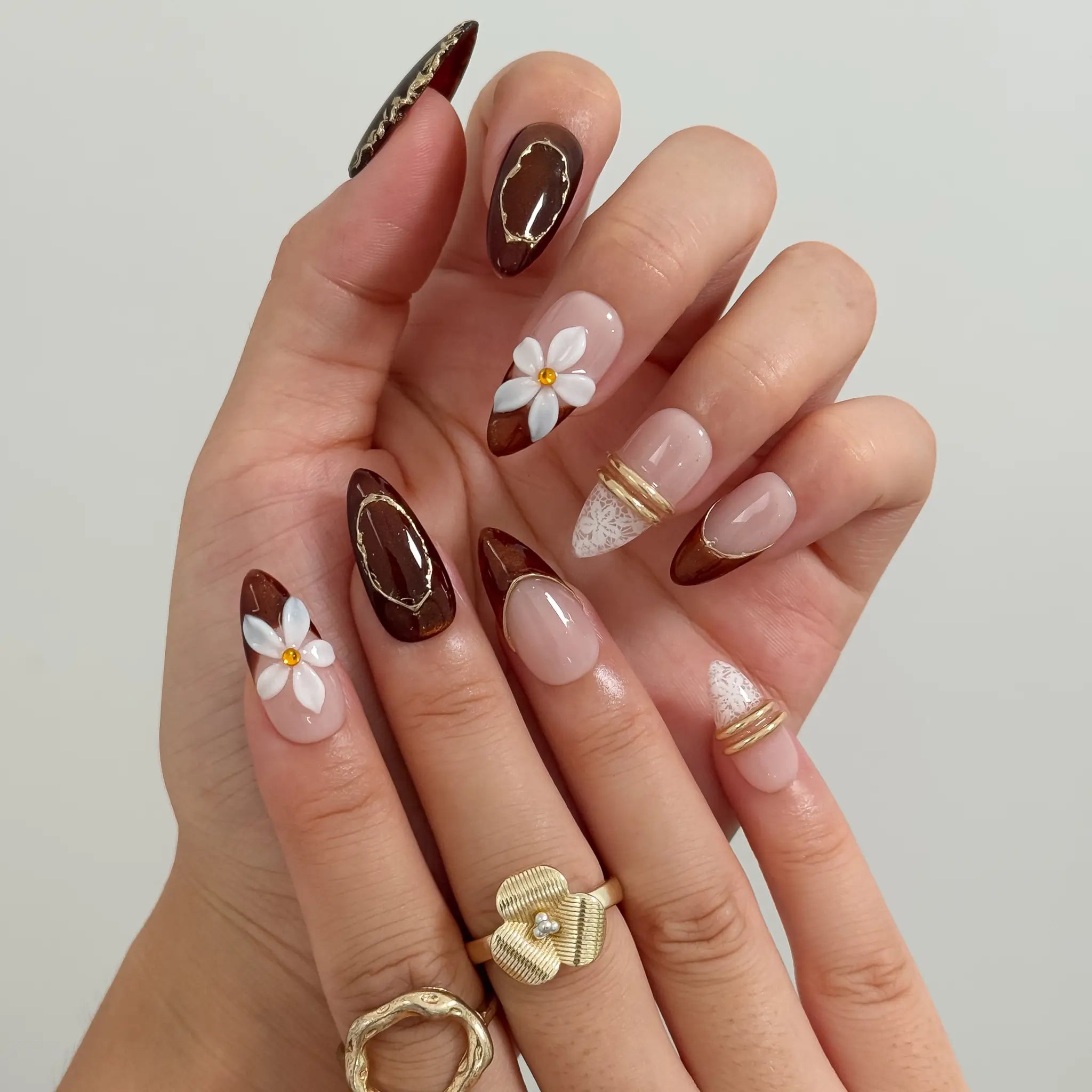 Mocha Blossom Lace Long Almond press-on nails, modeled detail view 2