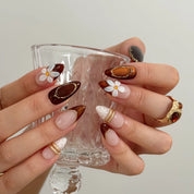 Mocha Blossom Lace Long Almond press-on nails, modeled detail view 3