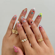 Candy Gem Parade Long Almond press-on nails, modeled detail view 1