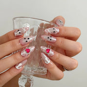 Blushing Phantom Heart Long Almond press-on nails, modeled detail view 3