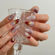 Burgundy Foil Reverie Long Almond press-on nails, modeled detail view 4