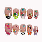Candy Gem Parade press-on nails in Pink, Red, Orange, Green, Blue, Purple, White, Black, Gold on a white background