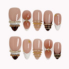 Gilded Tortoise Frame press-on nails in Nude, White, Brown, Gold on a white background
