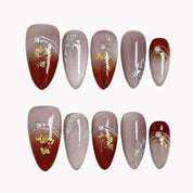 Burgundy Foil Reverie press-on nails in Red, Silver, Gold, Nude on a white background