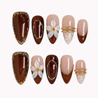 Mocha Blossom Lace press-on nails in Brown, Nude, White, Gold on a white background