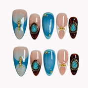 Turquoise Talisman press-on nails in Blue, Brown, Black, Gold, Nude, White on a white background