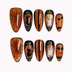 Midnight Pumpkin Portrait press-on nails in Orange, Black, Silver, White on a white background