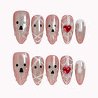 Blushing Phantom Heart press-on nails in Pink, White, Black on a white background
