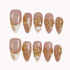 Gilded Magnolia Veil press-on nails in Nude, White, Gold on a white background