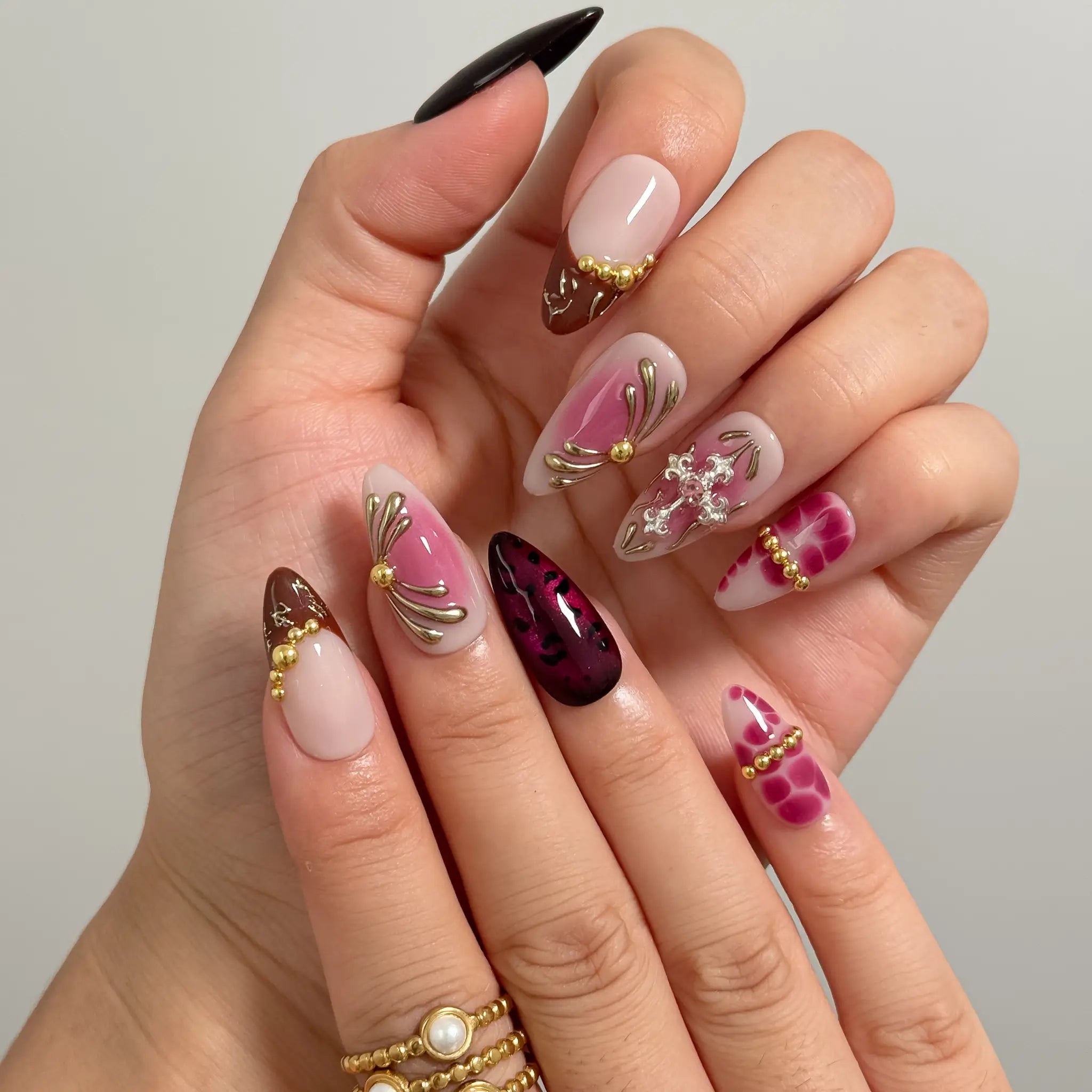 Crimson Rosary Bloom Long Almond press-on nails, modeled detail view 1