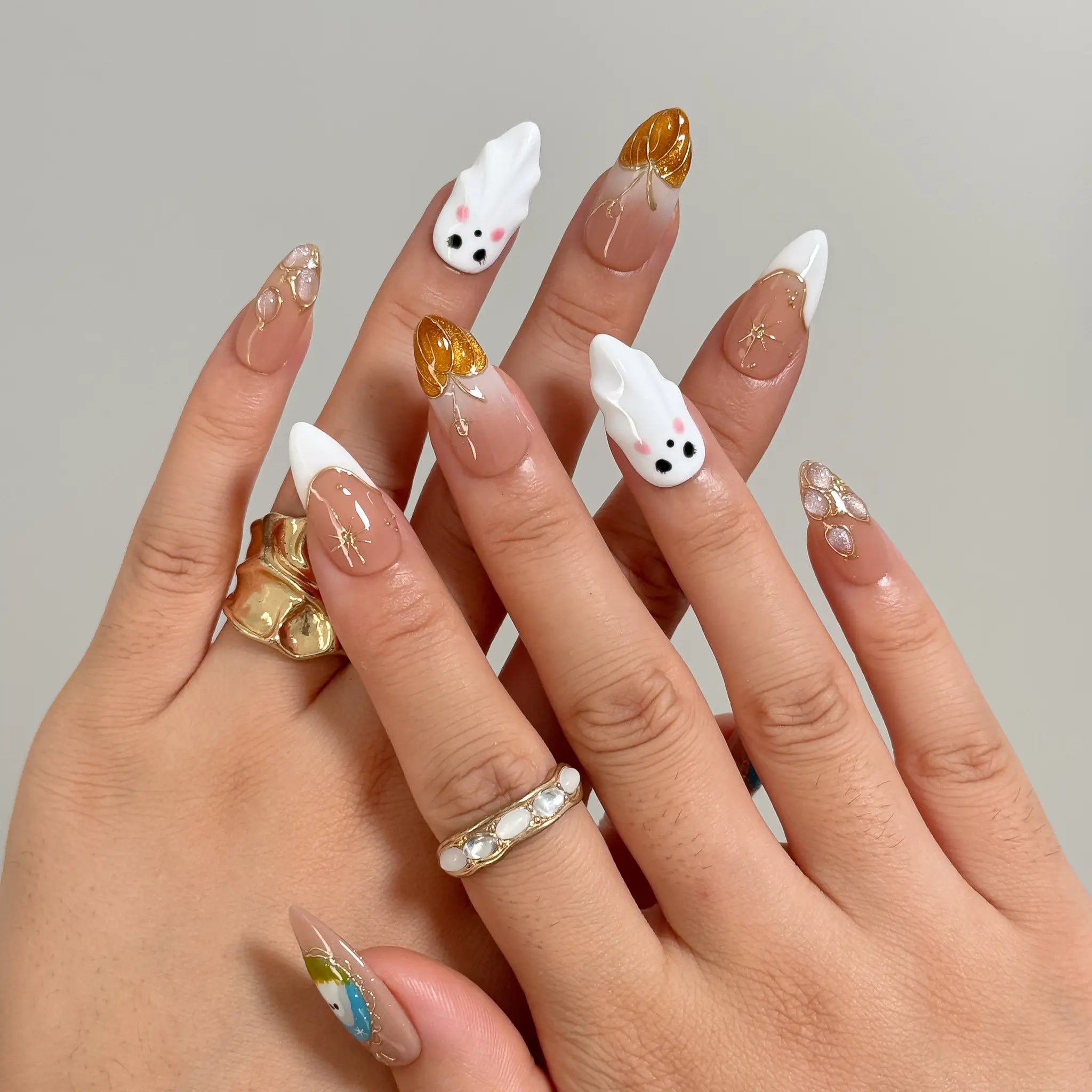 Amber Ghost Lantern Long Almond press-on nails, modeled detail view 1