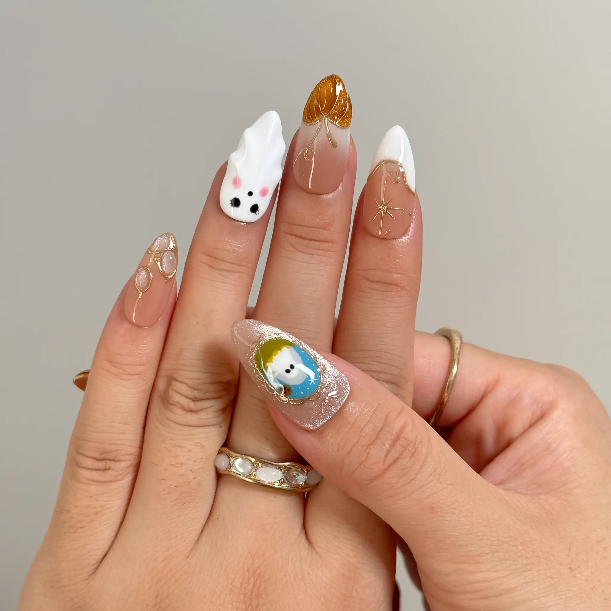 Amber Ghost Lantern Long Almond press-on nails, modeled detail view 2