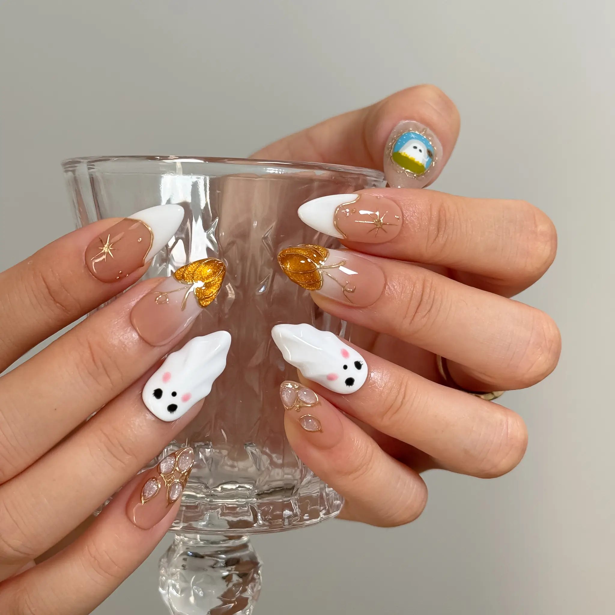 Amber Ghost Lantern Long Almond press-on nails, modeled detail view 3