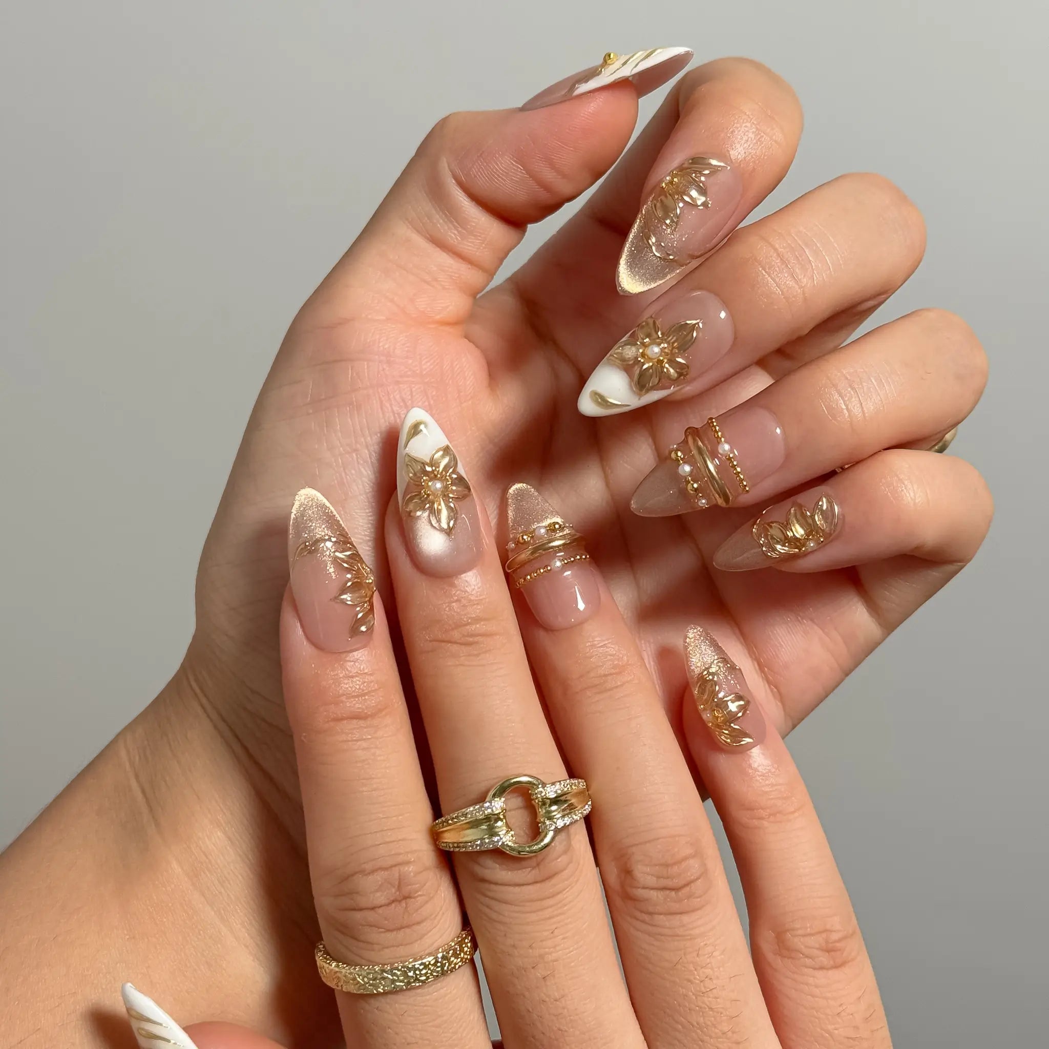 Gilded Magnolia Veil Long Almond press-on nails, modeled detail view 1