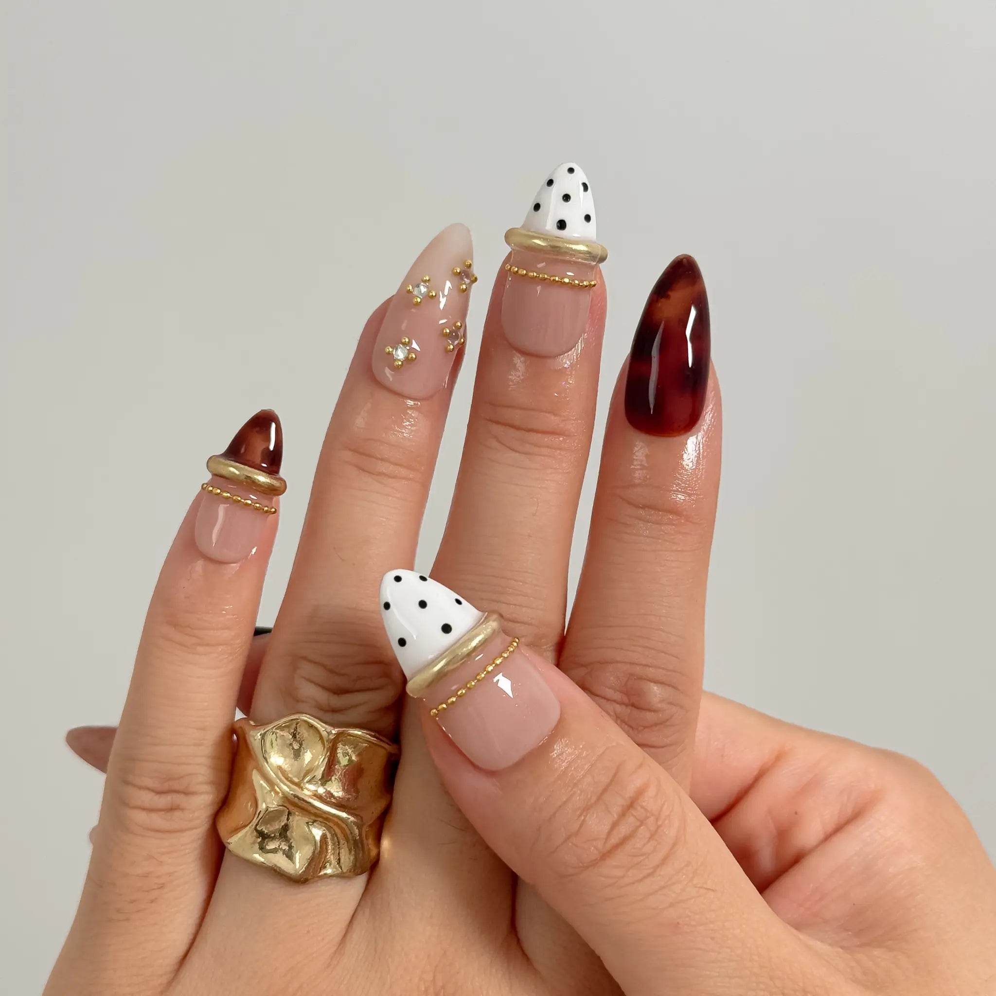 Tortoise Ribbon Reverie Long Stiletto press-on nails, modeled detail view 3