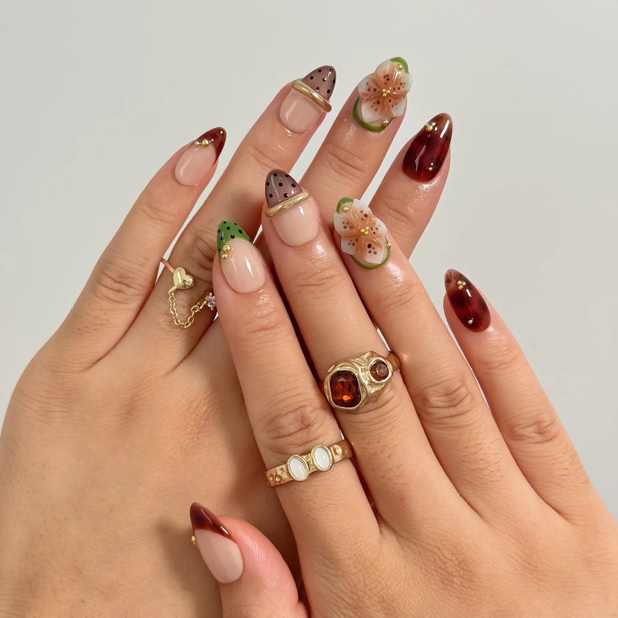 Orchard Truffle Bloom Long Almond press-on nails, modeled detail view 1