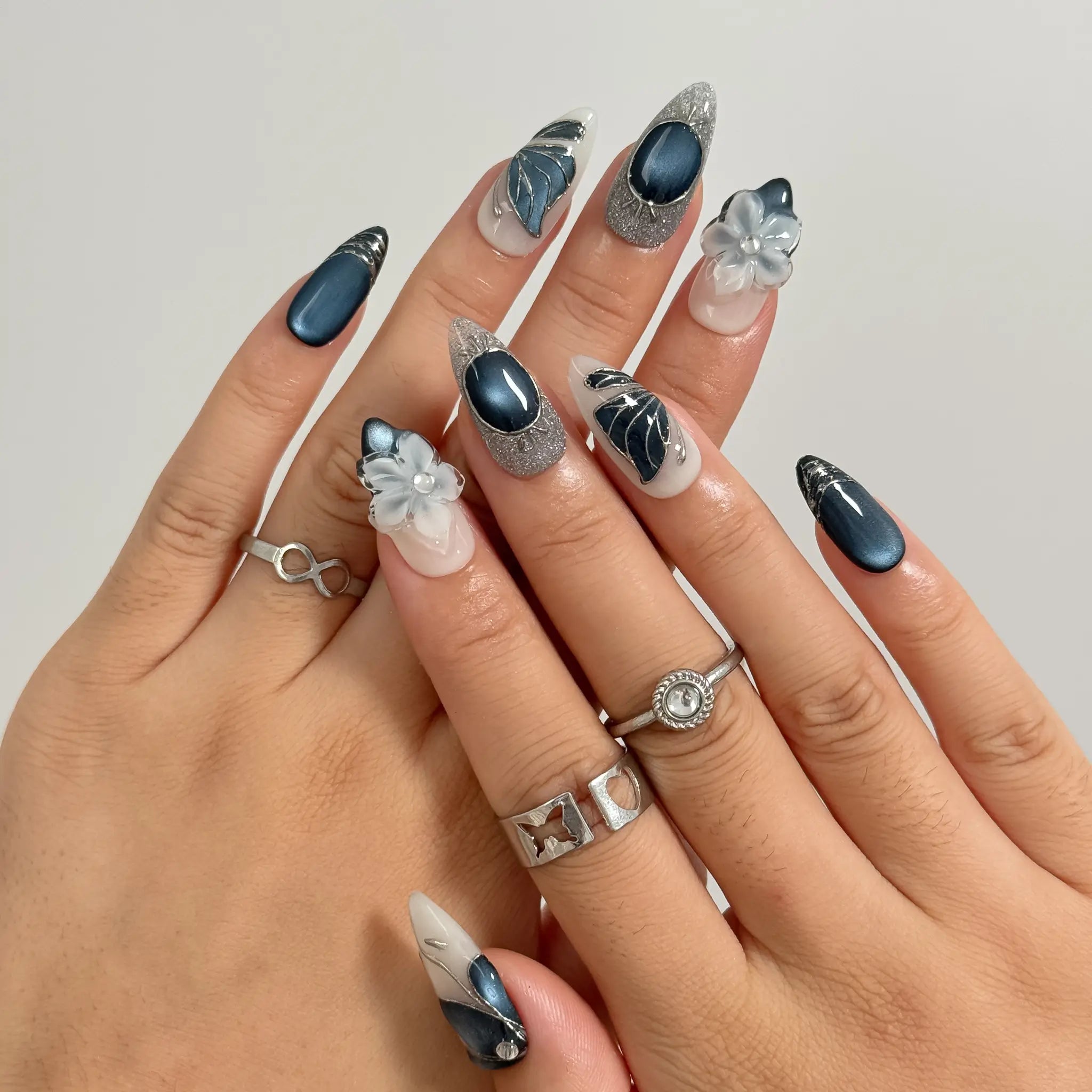 Midnight Petal Sonata Long Almond press-on nails, modeled detail view 1